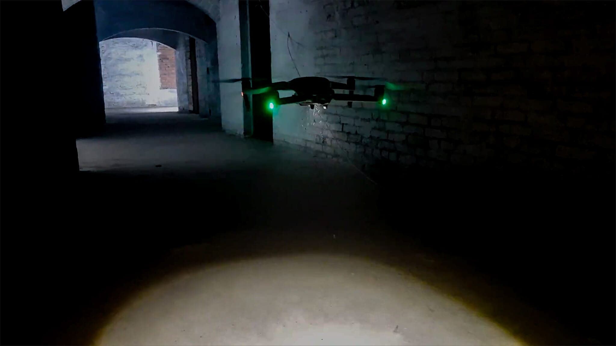 Mavic 2 drone flying in a dark tunnel